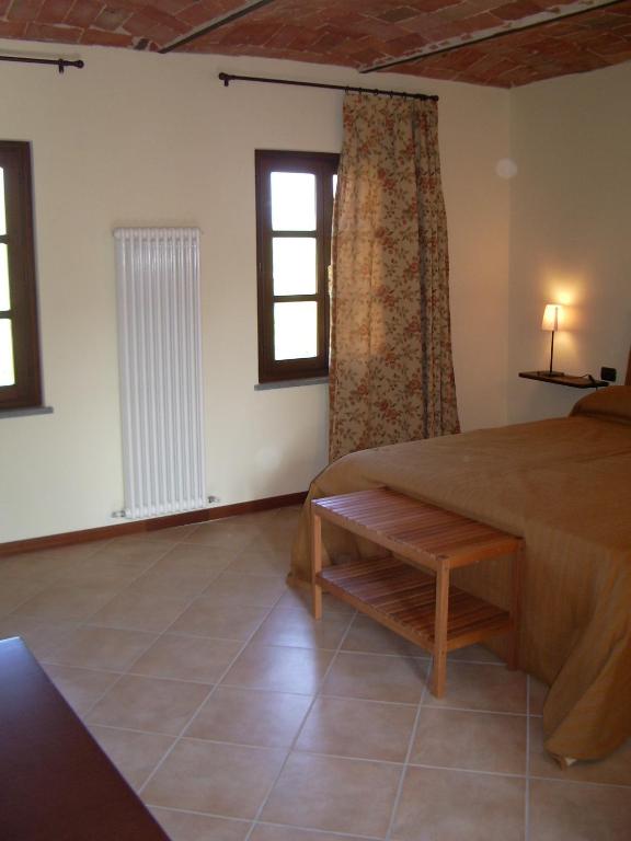 Postel nebo postele na pokoji v ubytování B&B Cascina Gaione Via Gallina,18b 12052 Neive cn