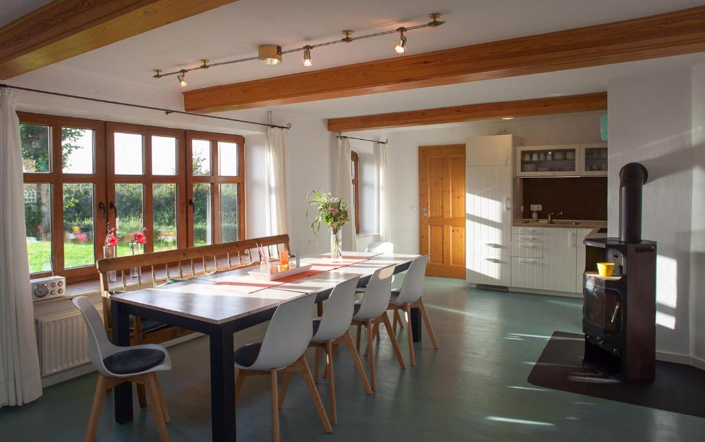 a kitchen and dining room with a table and chairs at Landhaus Hohe Luft in Steinberg