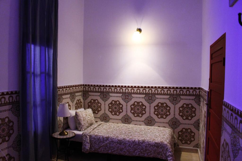 Ліжко або ліжка в номері Riad Meftaha