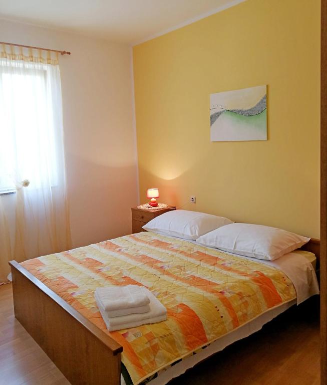 Postel nebo postele na pokoji v ubytování Apartments Ines