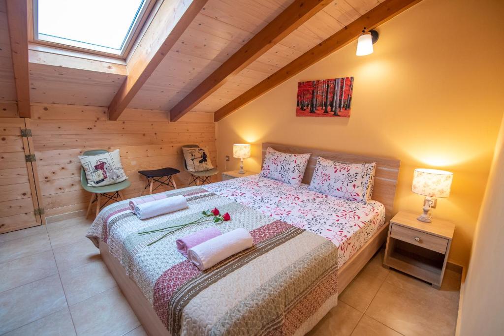 a bedroom with a large bed in a room at Soffitta Luminosa in Preveza