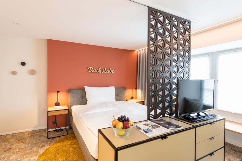 TV a/nebo společenská místnost v ubytování Hotel an der Aare Swiss Quality