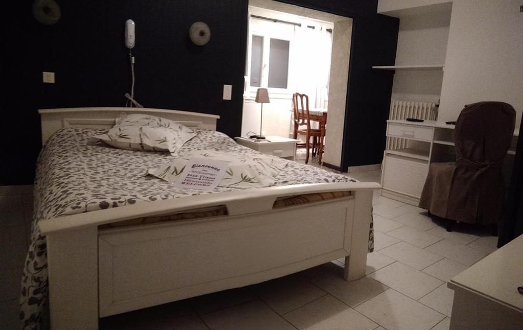 Un ou plusieurs lits dans un hébergement de l'établissement Hôtel Résidence Larroque