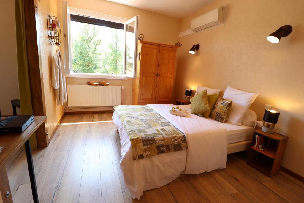 Postel nebo postele na pokoji v ubytování AUBERGE LE GABACHOU