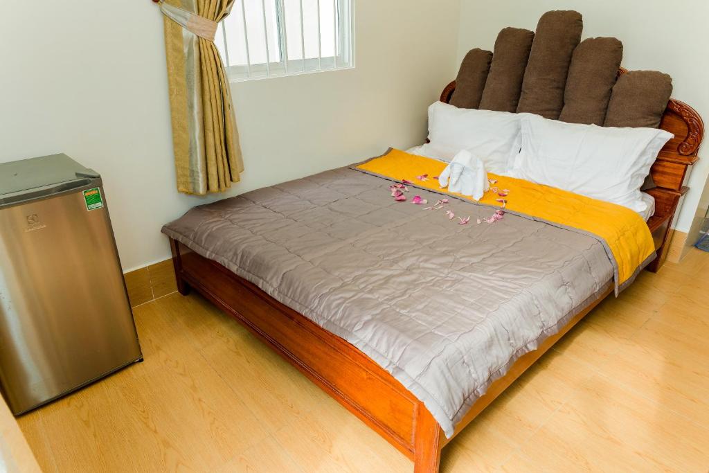 Postel nebo postele na pokoji v ubytování Buddha Homestay