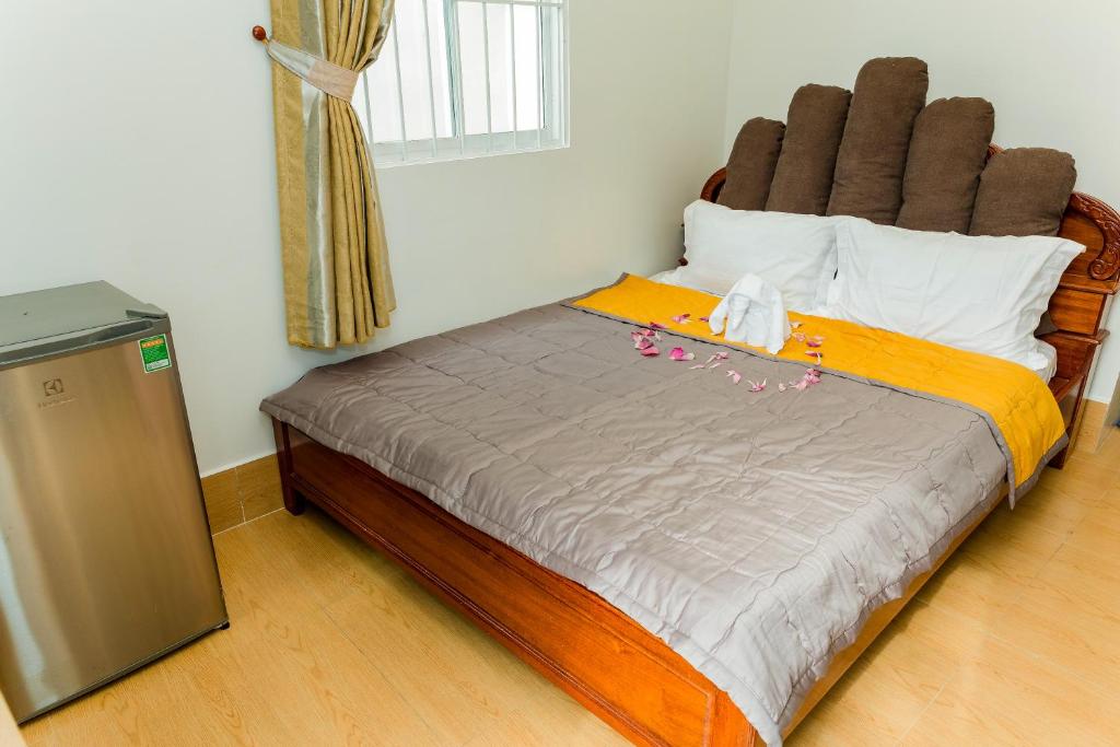 Postel nebo postele na pokoji v ubytování Buddha Homestay