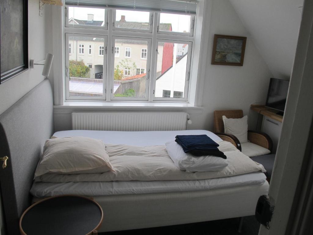 A bed or beds in a room at Guesthouse Sharon Aarhus