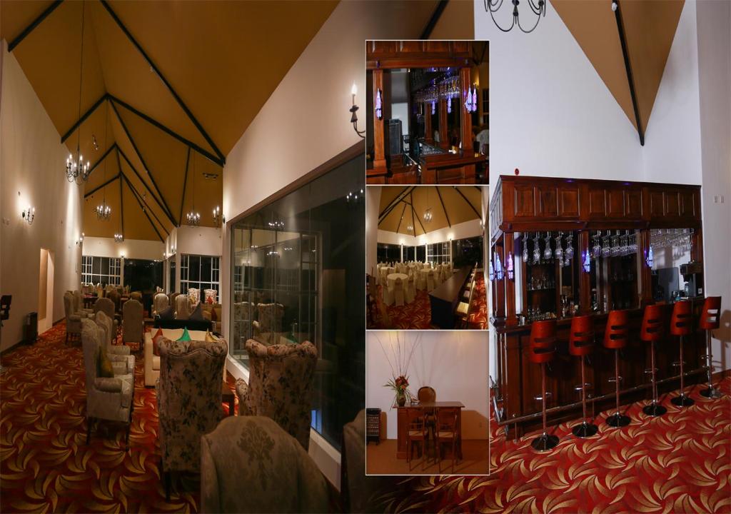 a room with a bar with chairs and a table at The Blackpool Resort & Spa in Nuwara Eliya