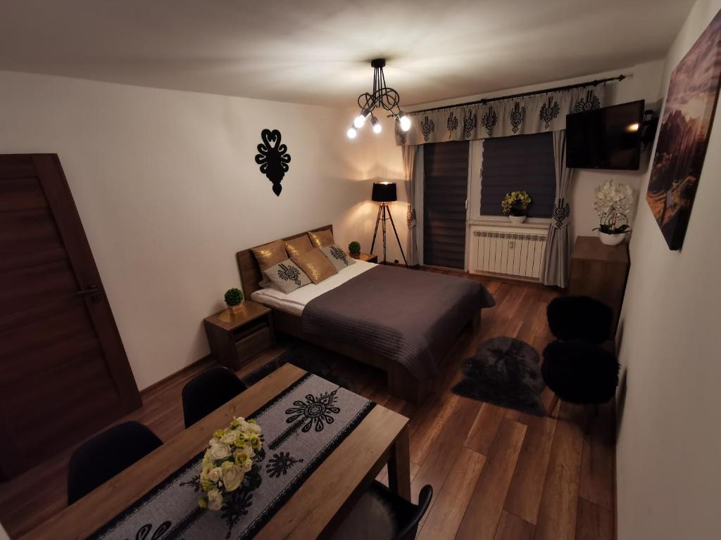 Posteľ alebo postele v izbe v ubytovaní Apartament Krupówki Centrum