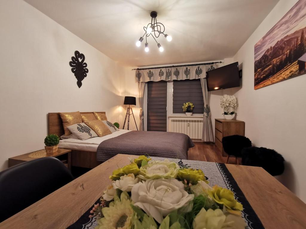 Posteľ alebo postele v izbe v ubytovaní Apartament Krupówki Centrum