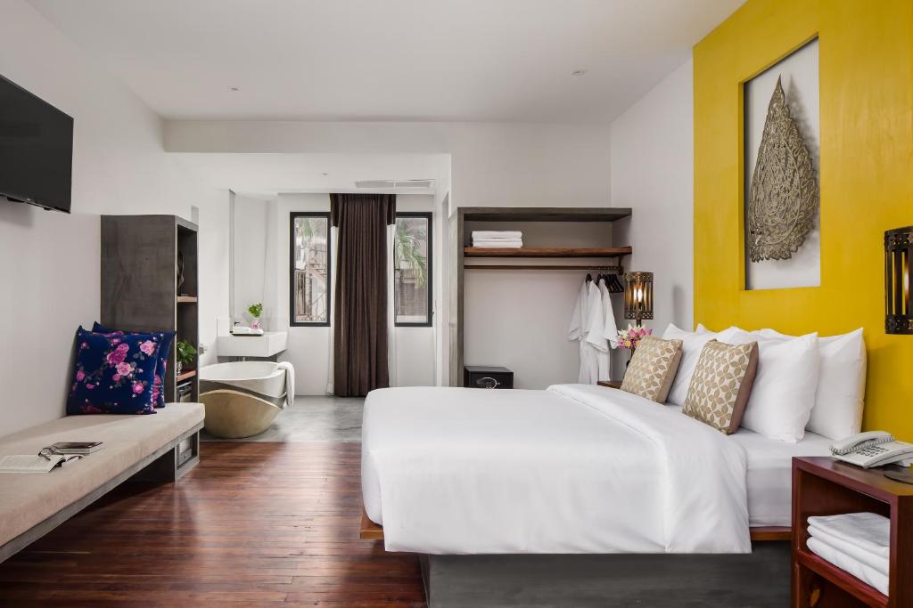 Postel nebo postele na pokoji v ubytování Siem Reap Palace Hotel & Spa