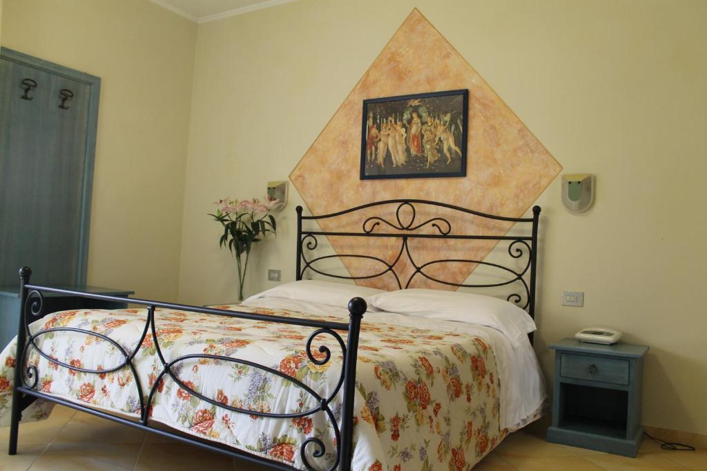 Postel nebo postele na pokoji v ubytování Hotel Ismaele