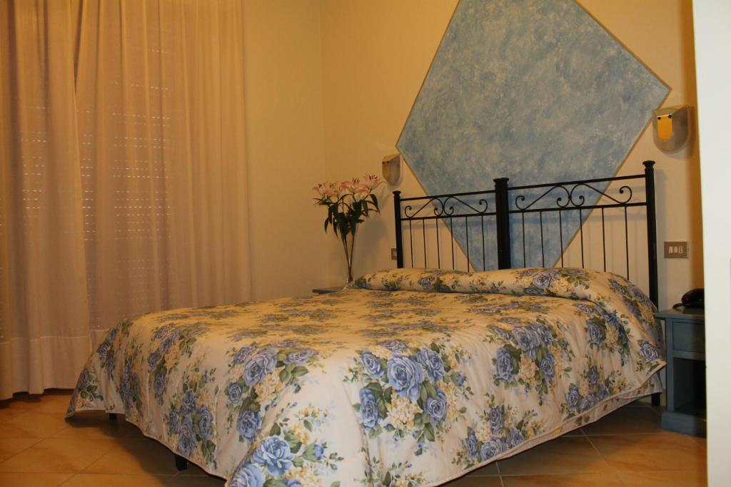 Postel nebo postele na pokoji v ubytování Hotel Ismaele