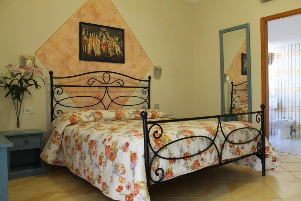 Postel nebo postele na pokoji v ubytování Hotel Ismaele