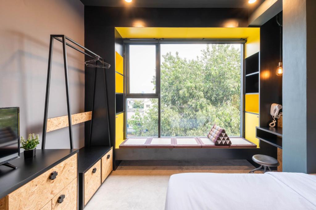 Postel nebo postele na pokoji v ubytování LOBSUEK Hostel