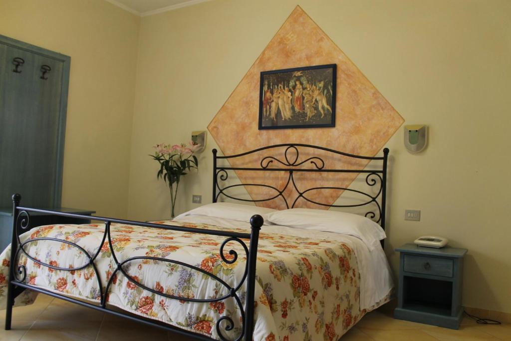 Postel nebo postele na pokoji v ubytování Hotel Ismaele