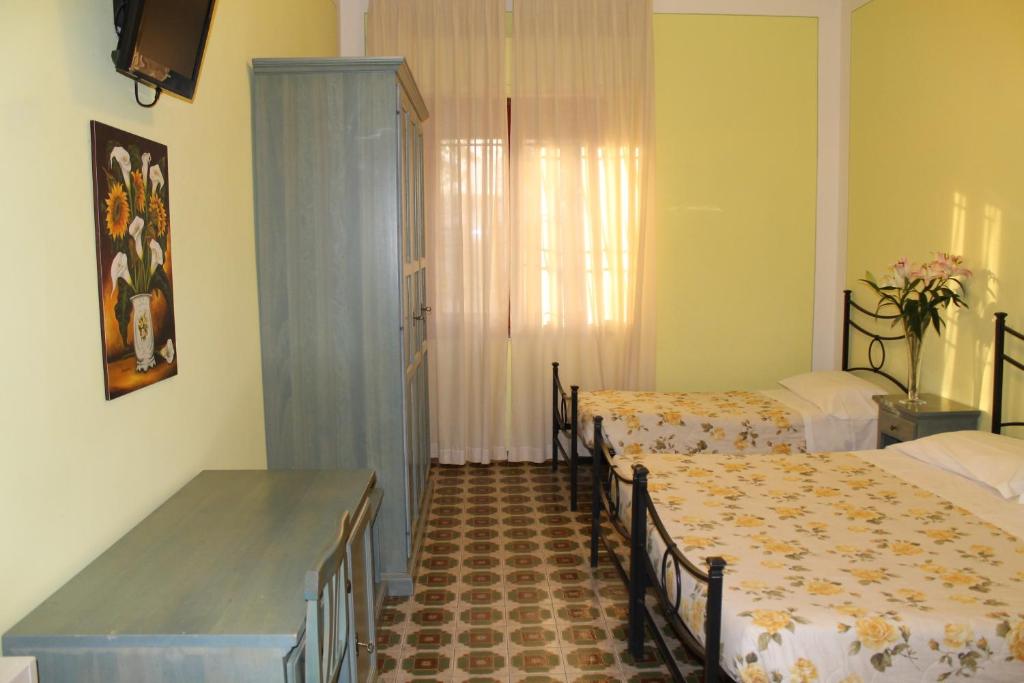 Postel nebo postele na pokoji v ubytování Hotel Ismaele