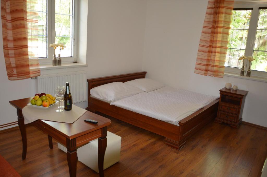 Postel nebo postele na pokoji v ubytování Apartmány Divoký Anděl