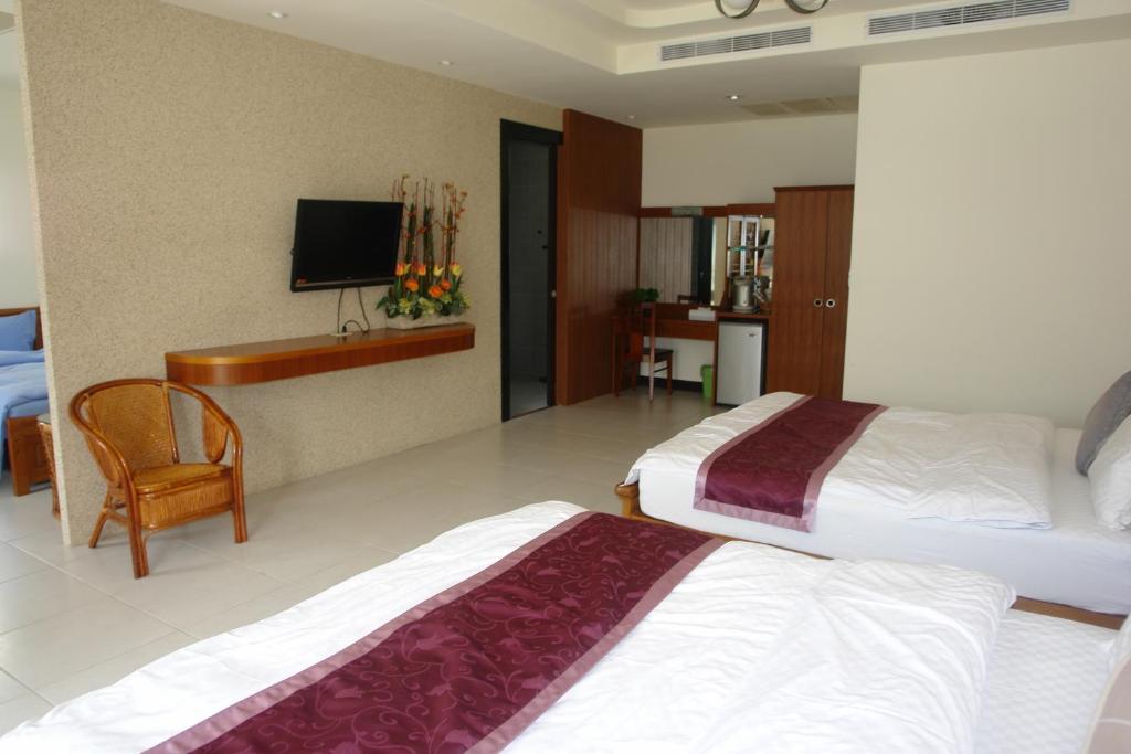 Postel nebo postele na pokoji v ubytování Hualien Sheraton Hostel
