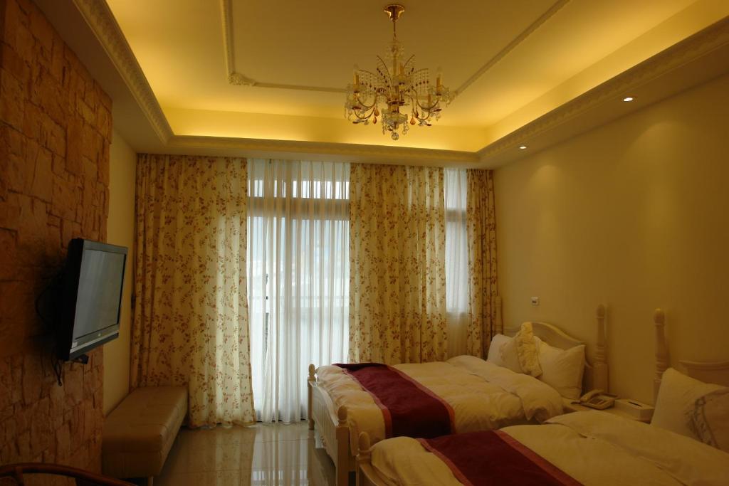 Postel nebo postele na pokoji v ubytování Hualien Sheraton Hostel