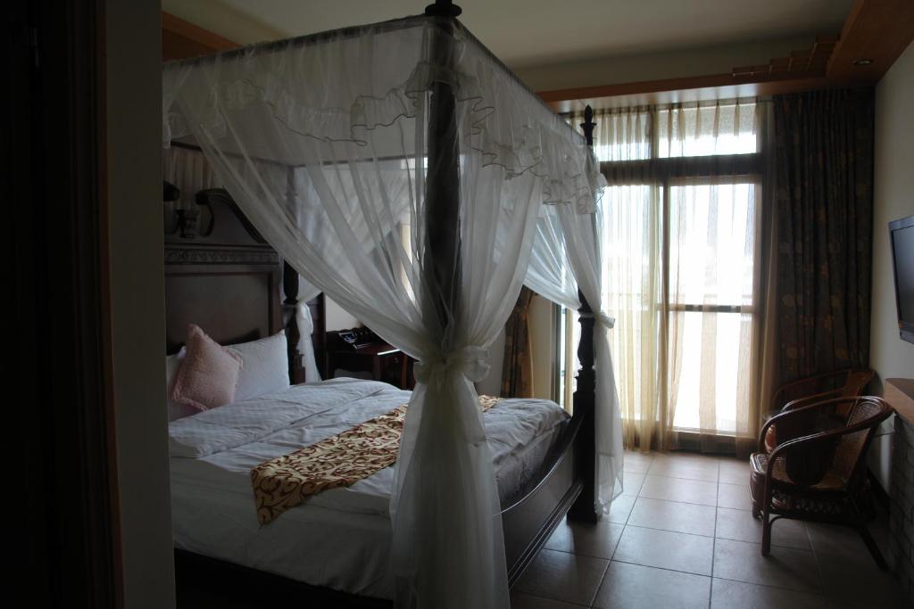 Postel nebo postele na pokoji v ubytování Hualien Sheraton Hostel