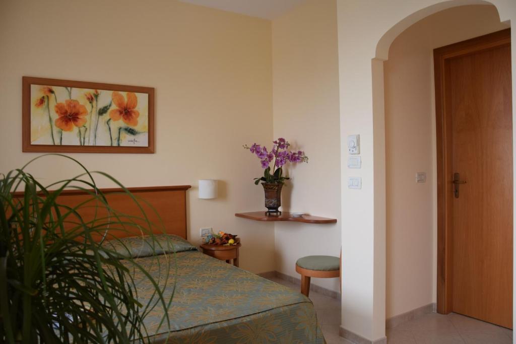 Postel nebo postele na pokoji v ubytování Hotel Tirreno