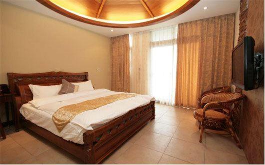 Säng eller sängar i ett rum på Hualien Sheraton Hostel