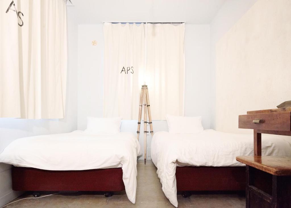 Postel nebo postele na pokoji v ubytování Apartment Hotel Shinjuku