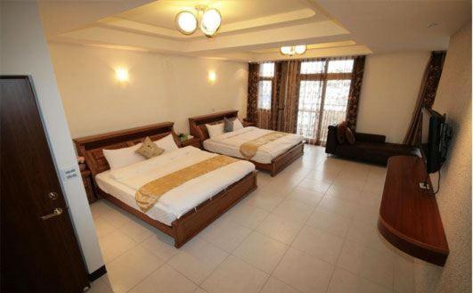 Postel nebo postele na pokoji v ubytování Hualien Sheraton Hostel