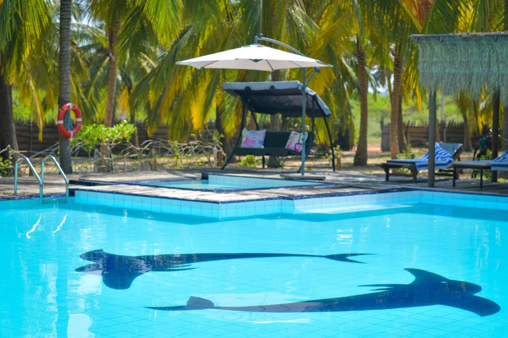 Bazén v ubytování De Silva Palm Resort nebo v jeho okolí