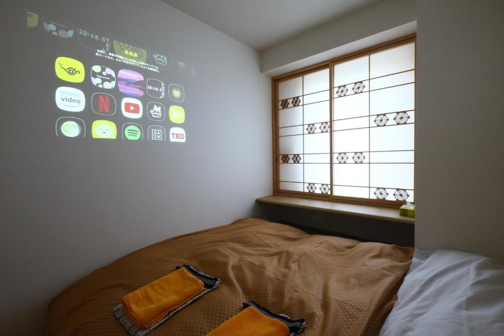 Postel nebo postele na pokoji v ubytování Wa Style Tokyo