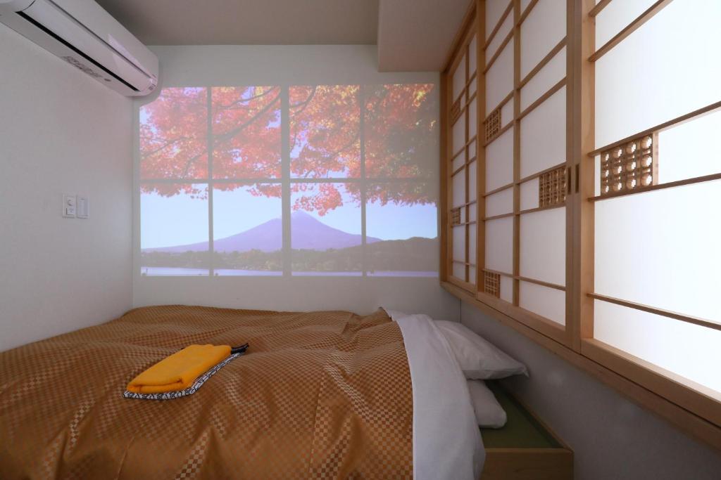 Postel nebo postele na pokoji v ubytování Wa Style Tokyo