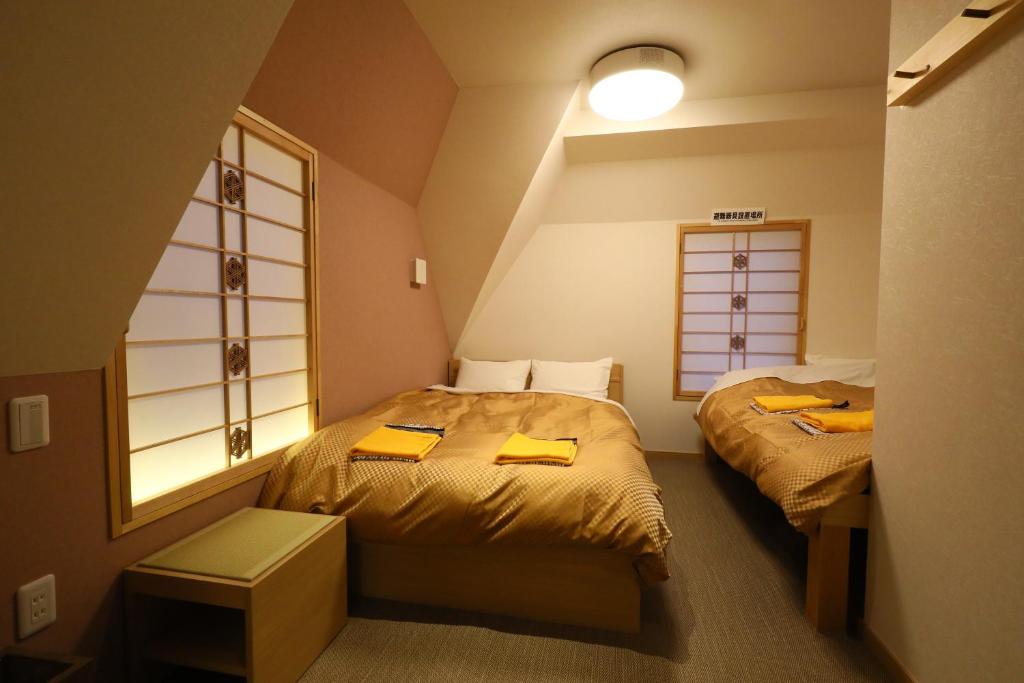 Postel nebo postele na pokoji v ubytování Wa Style Tokyo