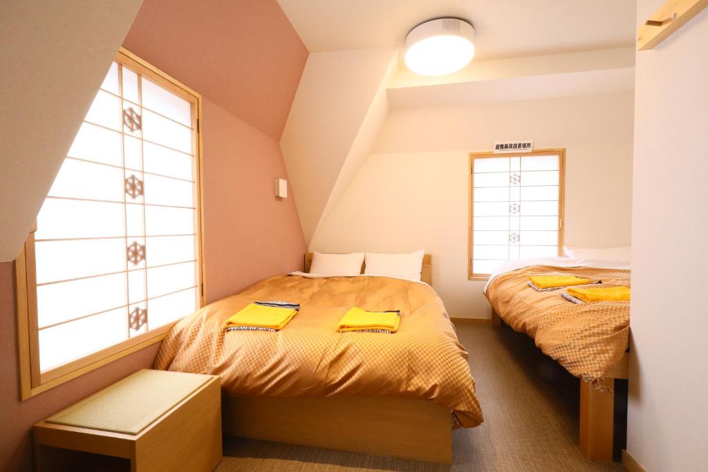 Cama o camas de una habitación en Tabist Wa Style Tokyo