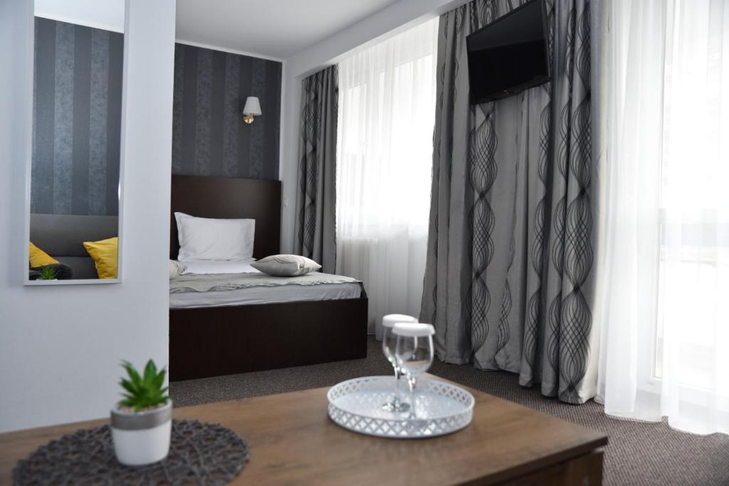 Postel nebo postele na pokoji v ubytování Hotel Magurele