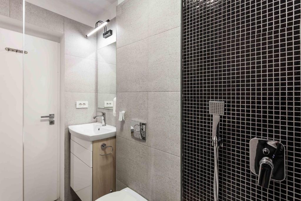 Koupelna v ubytování Martin Boutique Hotel