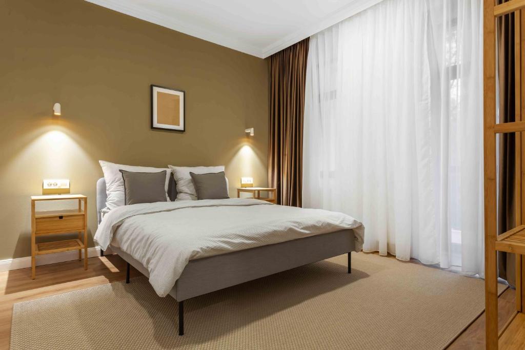 Postel nebo postele na pokoji v ubytování Martin Boutique Hotel