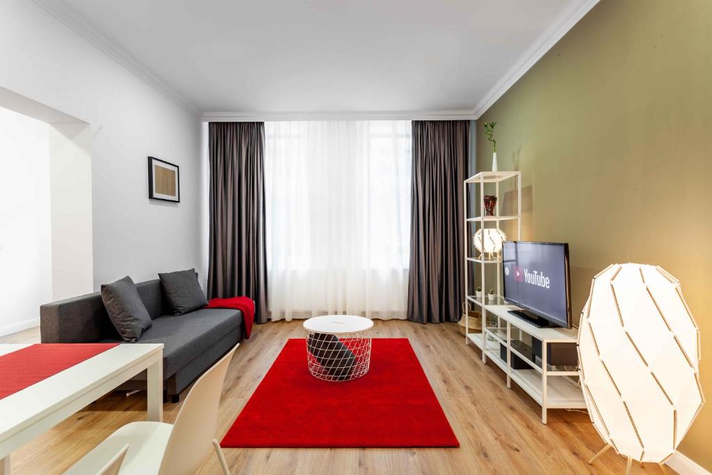 TV a/nebo společenská místnost v ubytování Martin Boutique Hotel
