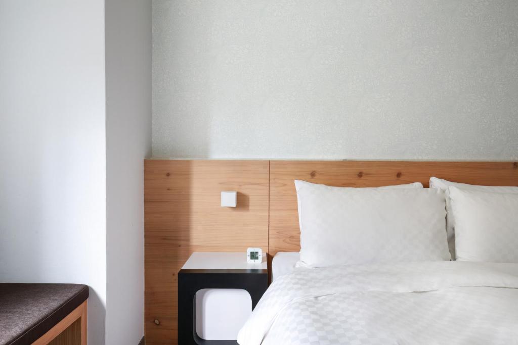 Postel nebo postele na pokoji v ubytování Dandy Hotel-Daan Park Branch