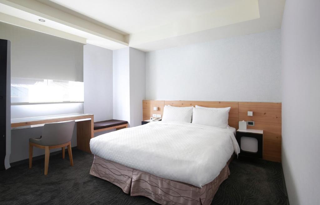 Postel nebo postele na pokoji v ubytování Dandy Hotel-Daan Park Branch