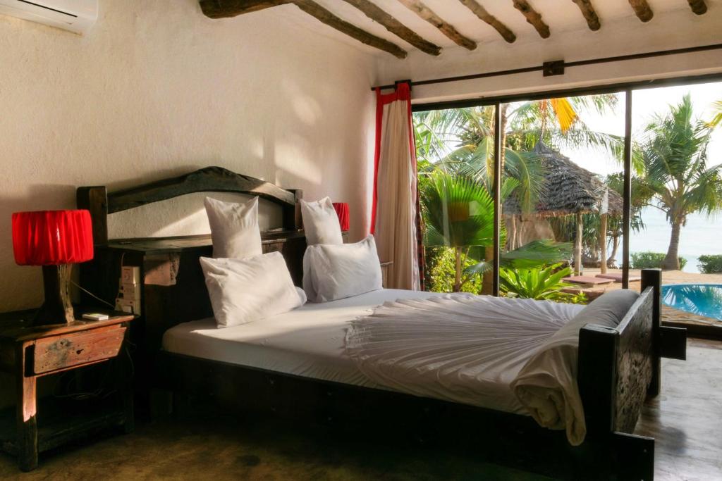 Postel nebo postele na pokoji v ubytování The Zanzibari
