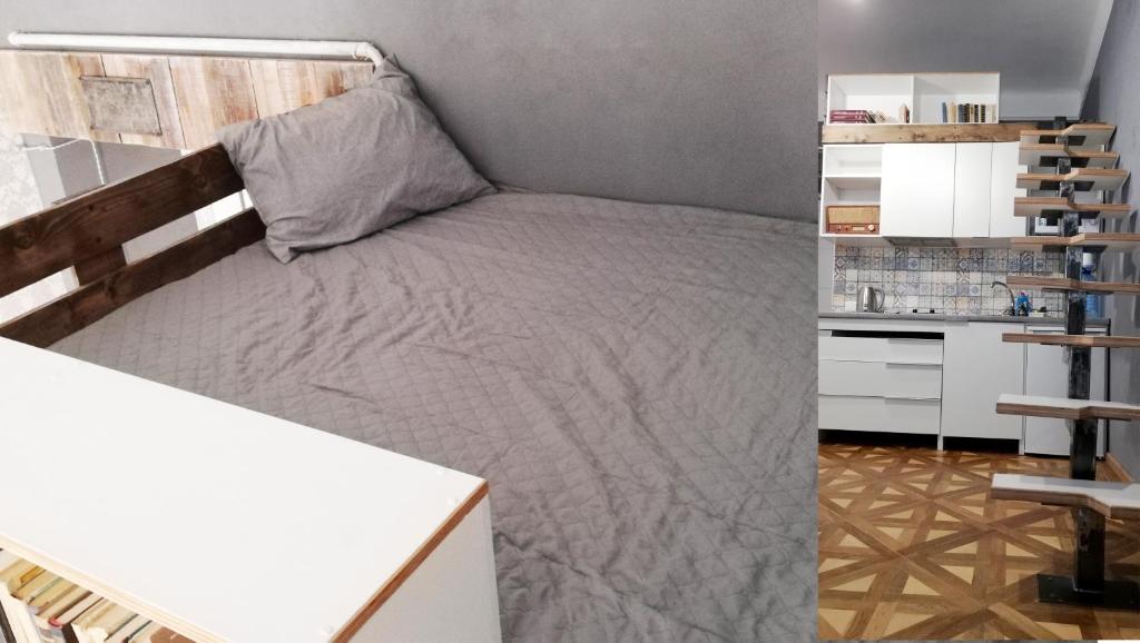 リヴィウにあるКвартира ЛОФТ 2 во Львовеの小さなベッドルーム(ベッド1台、デスク付)
