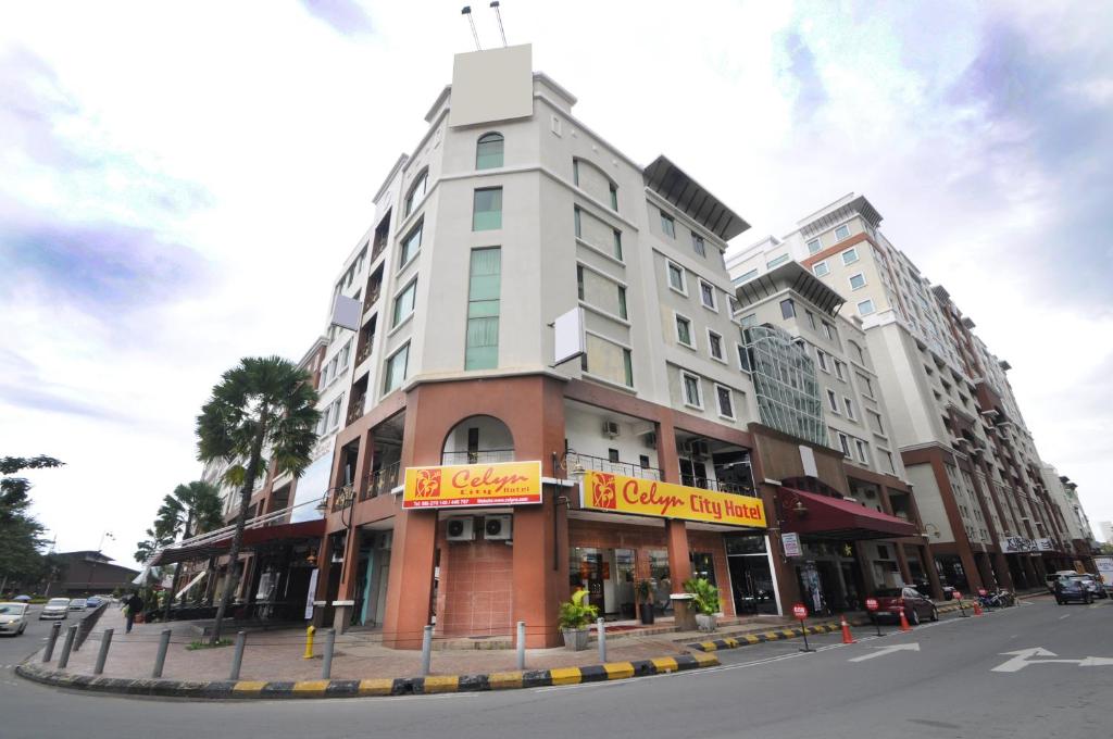 a large building on a city street with at Celyn City Hotel in Kota Kinabalu