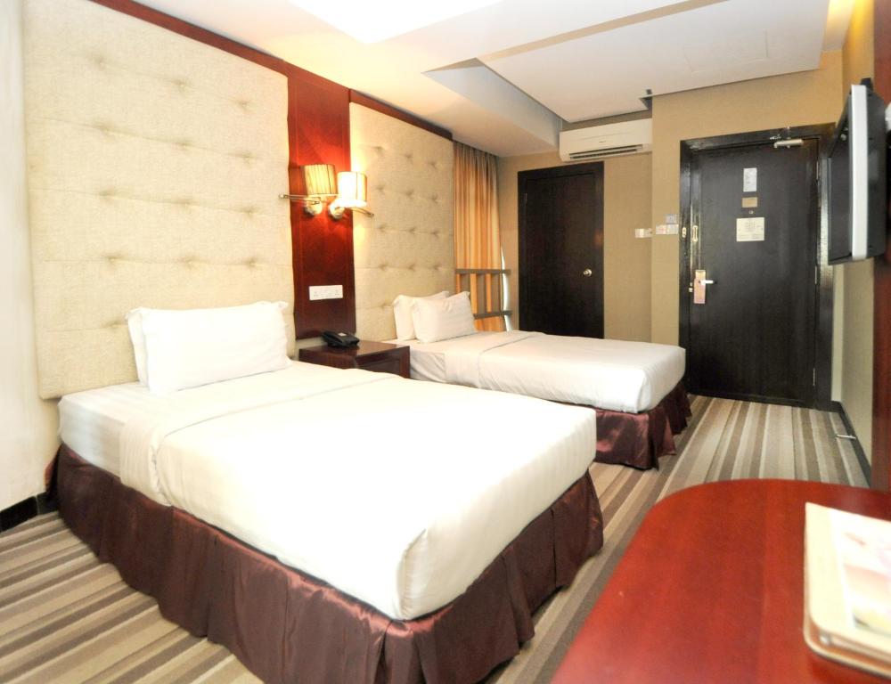 Postel nebo postele na pokoji v ubytování Celyn City Hotel