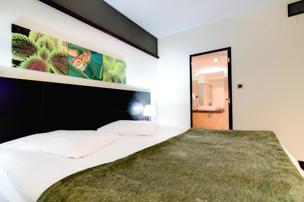 Postel nebo postele na pokoji v ubytování Hotel Orizont