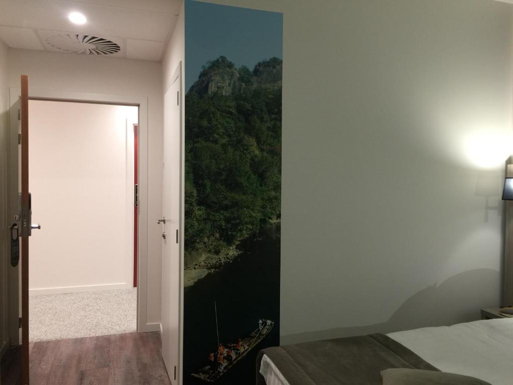 Postel nebo postele na pokoji v ubytování cité impériale ye