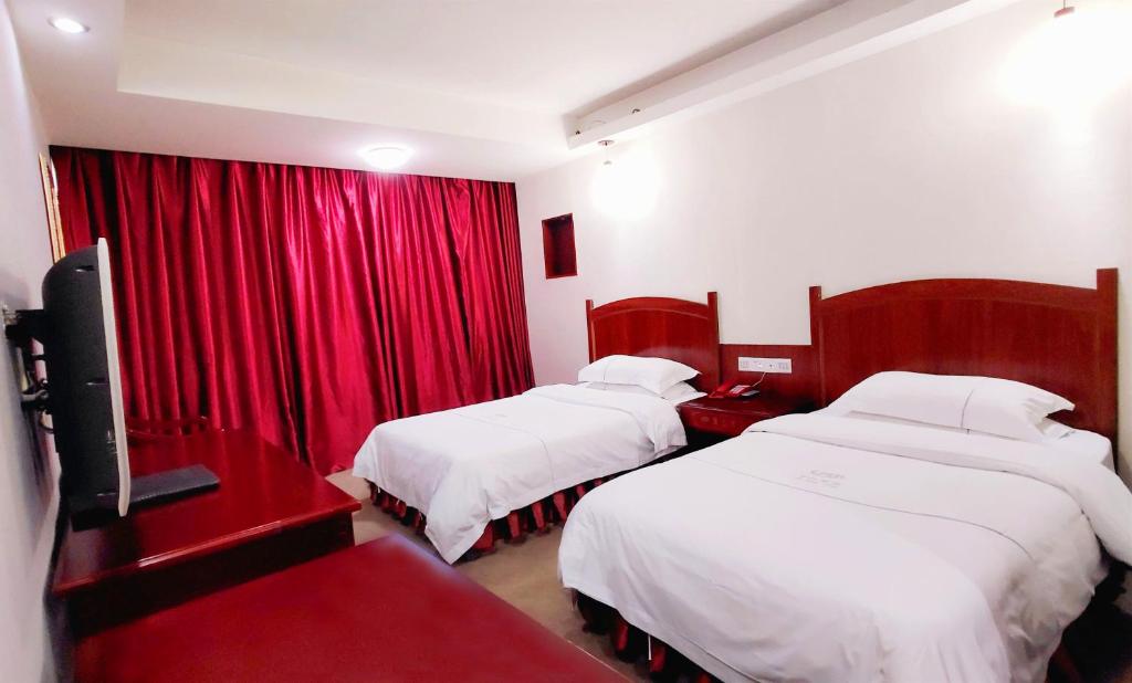 Postel nebo postele na pokoji v ubytování Guangzhou Junshan Hotel - Shuttle bus for Canton Fair