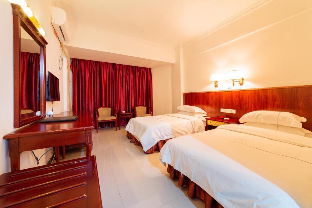 Postel nebo postele na pokoji v ubytování Guangzhou Junshan Hotel - Shuttle bus for Canton Fair