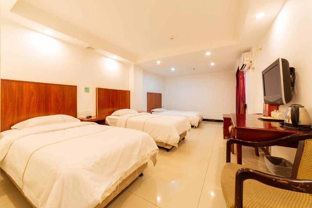 Postel nebo postele na pokoji v ubytování Guangzhou Junshan Hotel - Shuttle bus for Canton Fair