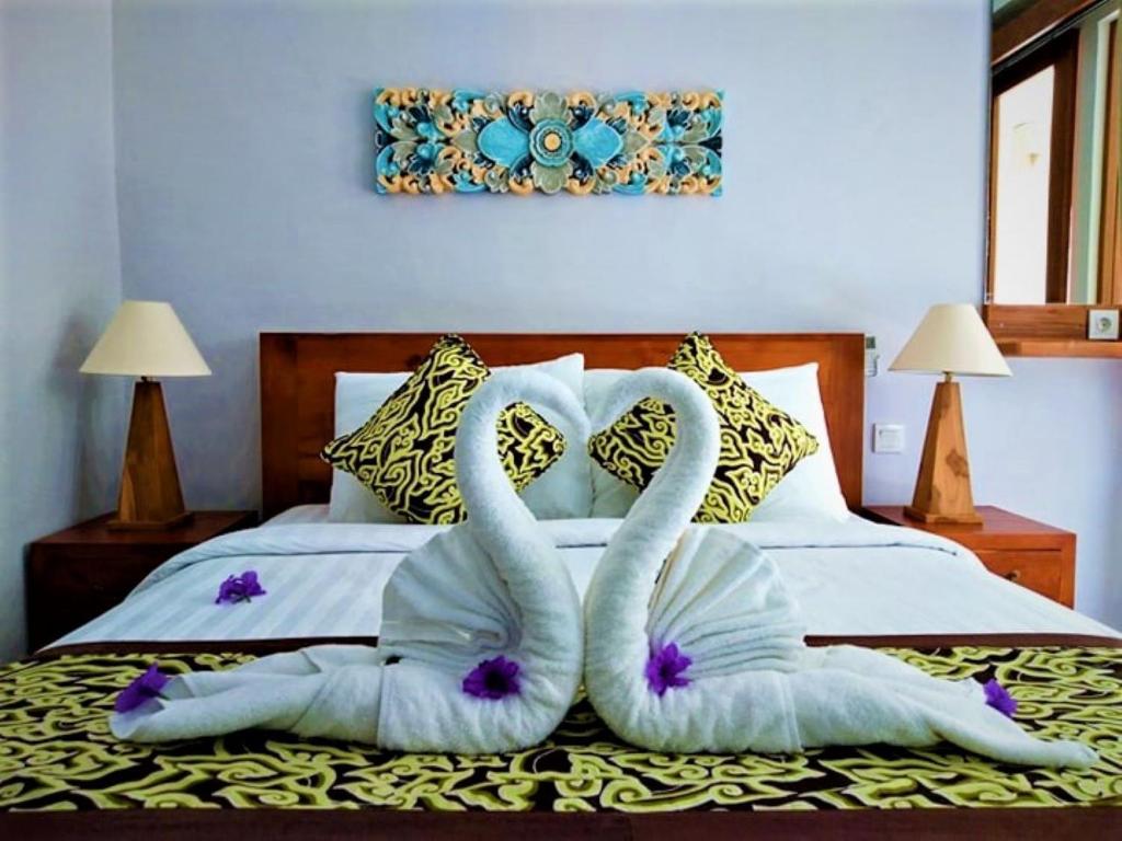 Postel nebo postele na pokoji v ubytování BatanTop Ubud guest house